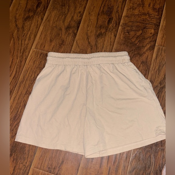 A loves a tan shorts bought from Dillards 💙 - Picture 2 of 2